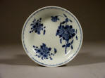 光緒 A Blue & White Guangxu Floral Saucer decorated with three medallions of peonies and periwinkles