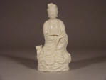 An 18th C figure of Guanyin seated at Royal Ease upon a rocky dais