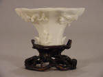 Late 明代 Ming Dynasty Dehua Rhinoceros Libation Cup on a carved stand of intertwined branches