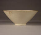 宋代 A Song Dinyao conical bowl with molded decoration of a fish in a lotus pond, formerly in the Riesco Collection