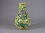 19th C 康熙 Kangxi style famille jaune pear shaped vase decorated with a full faced dragon on each side, Guangxu period