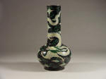 清代康熙 A Kangxi Famille Noire Bottle Vase Painted with a Writhing Dragon