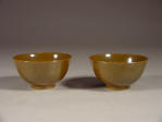 A pair of mark & period 光緒 Guangxu bowls covered in a deep tone cafe au lait brown glaze