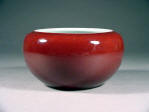 A rare 康熙 Kangxi mark and period copper red glazed alms bowl with a channeled foot rim